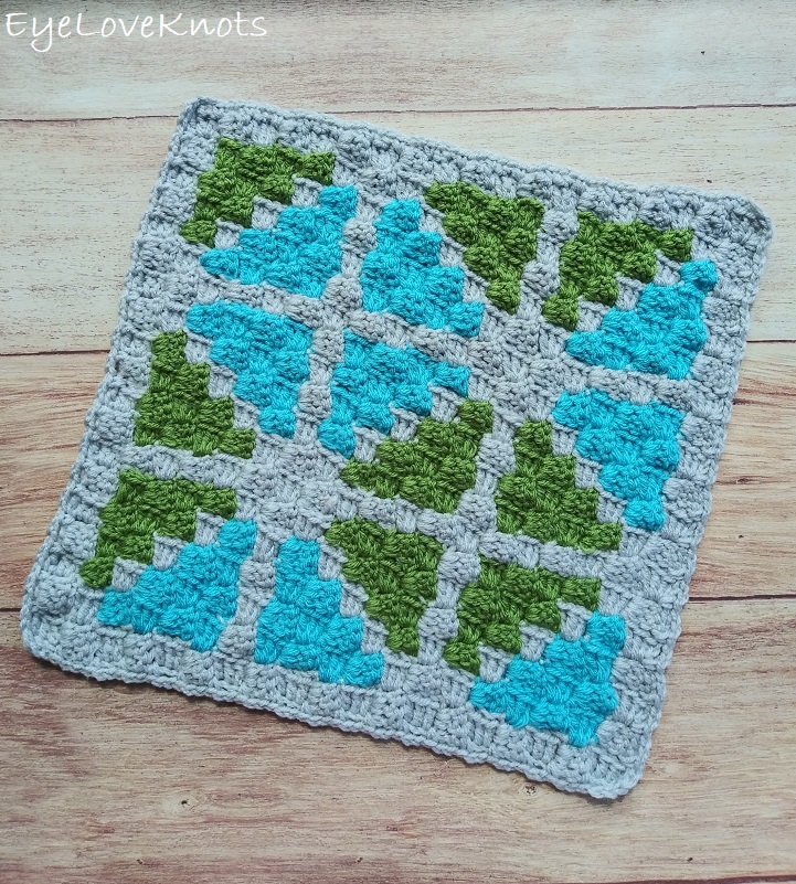 Finished image of C2C Window Pane Square - a geometric print of blue and green triangles.