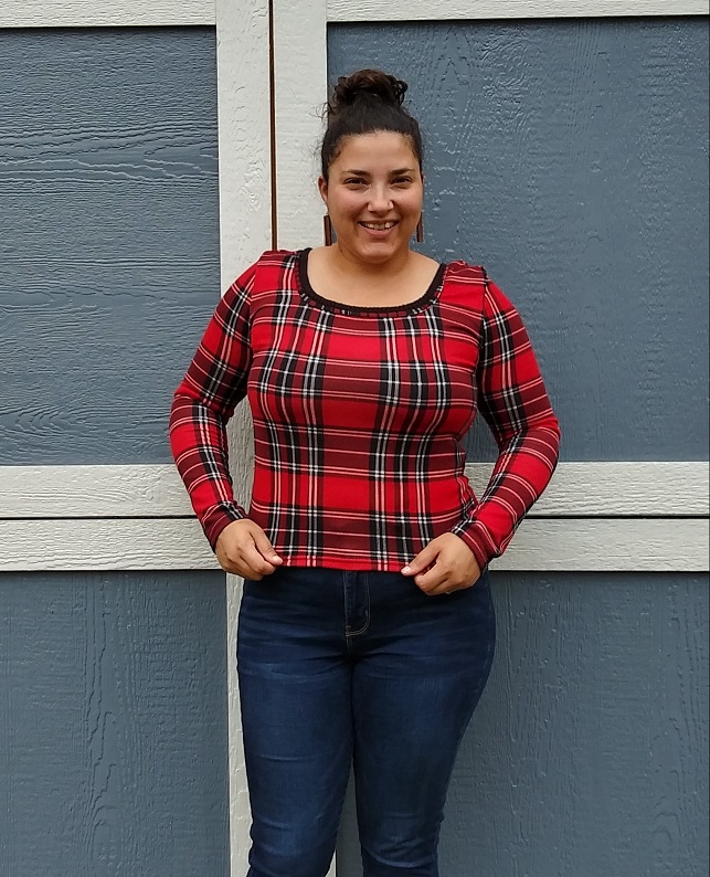 Fall outfit idea of plaid long sleeve shirt and jeans with wood dangle earrings