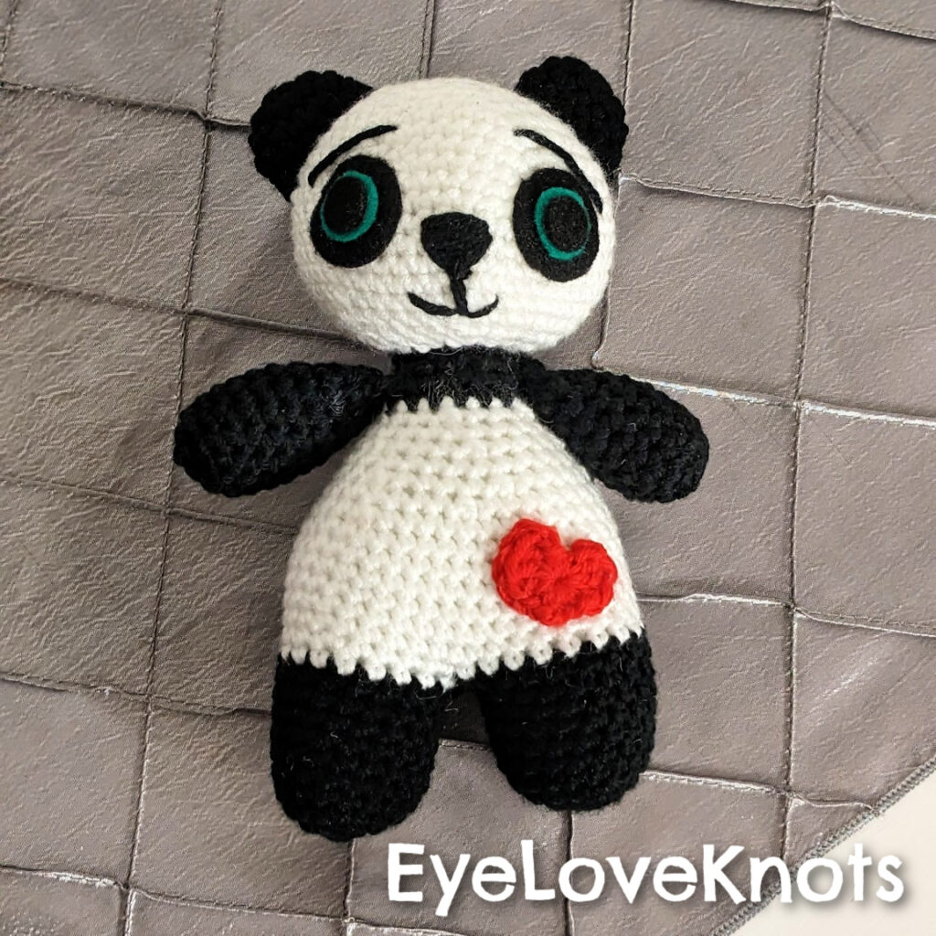 Made my first amigurumi with fluffy yarn! Not sure if I should add a nose  and mouth to her, she has some charm as she is : r/crochet